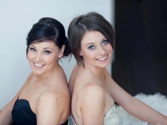 Joyful portrait of friends in elegant attire.