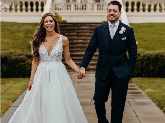 A couple enjoys a joyful moment after their wedding ceremony.
