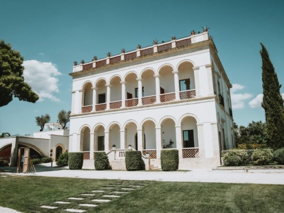 A charming villa surrounded by lush greenery.