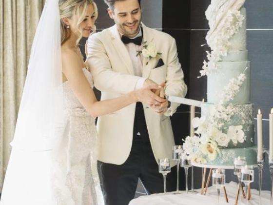 Celebrating their special day with a cake cutting ceremony.
