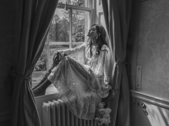 A reflective moment captured in soft monochrome.