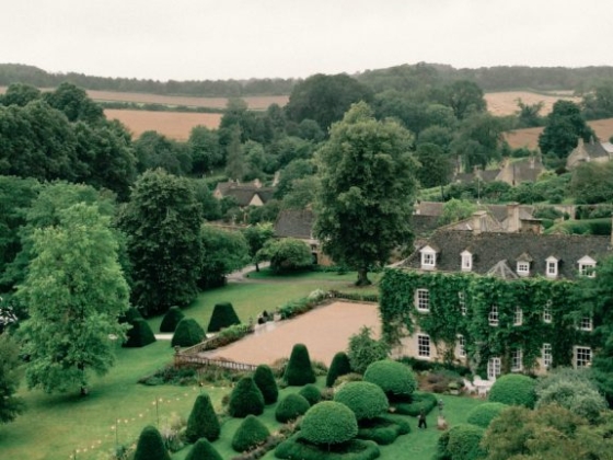 Aerial view of a landscaped garden and countryside.