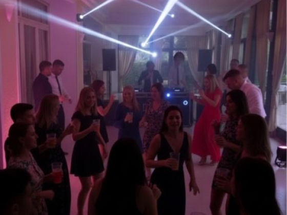 Guests enjoying a lively dance party indoors.
