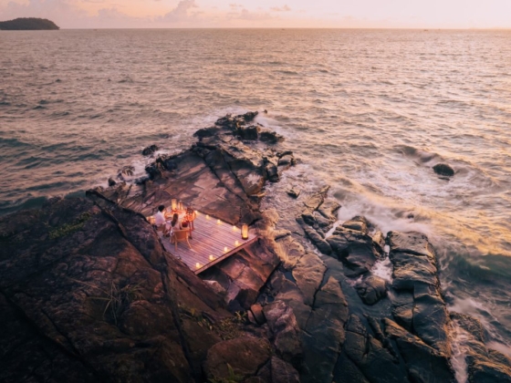 A romantic dinner setting on the coast.