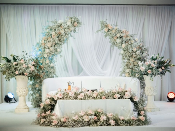 Beautifully arranged wedding altar with fresh flowers.