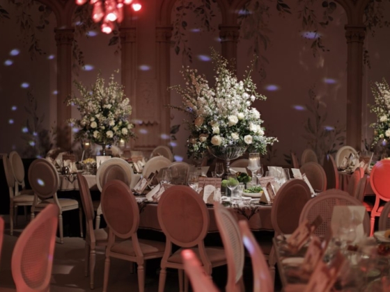 A beautifully arranged banquet table with flowers.