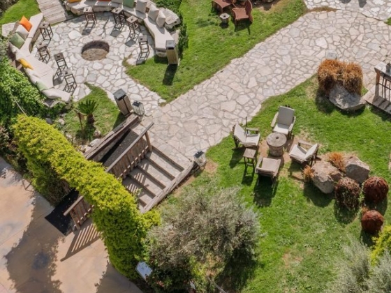 Inviting outdoor space with paths and seating arrangements.