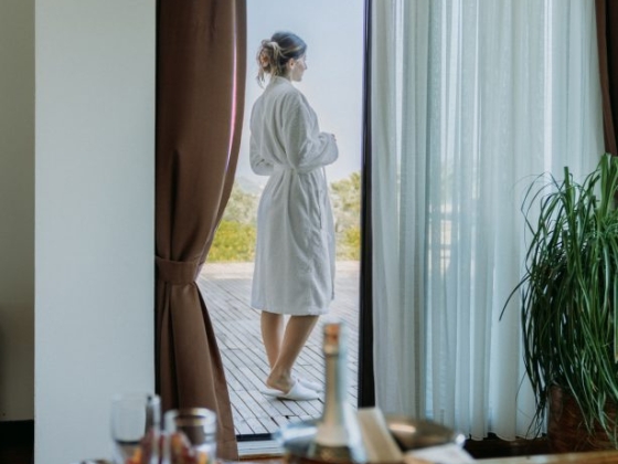 A relaxing moment by the open door overlooking nature.