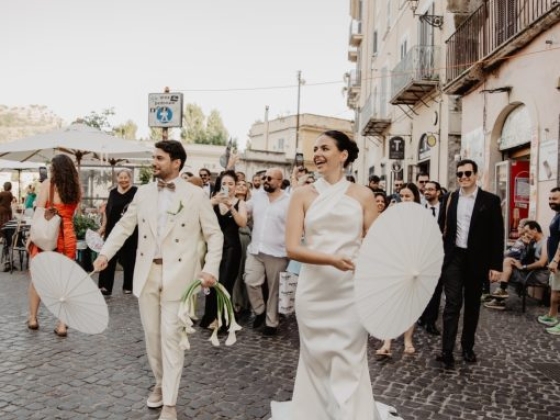 Wedding celebration in a charming street setting.