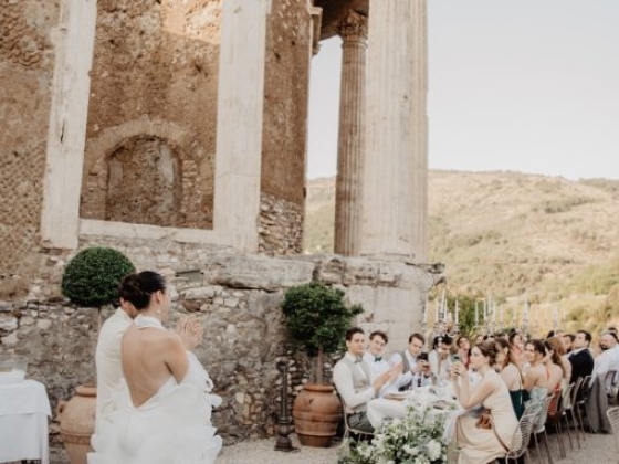 Couple exchanging vows at a picturesque outdoor setting.