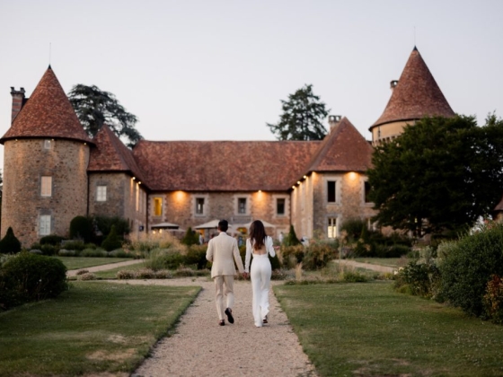 Romantic scene of a couple by a castle garden.