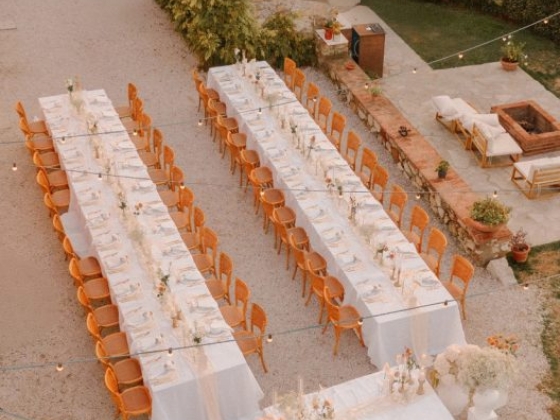 Elegant arrangement for a large outdoor dinner event.