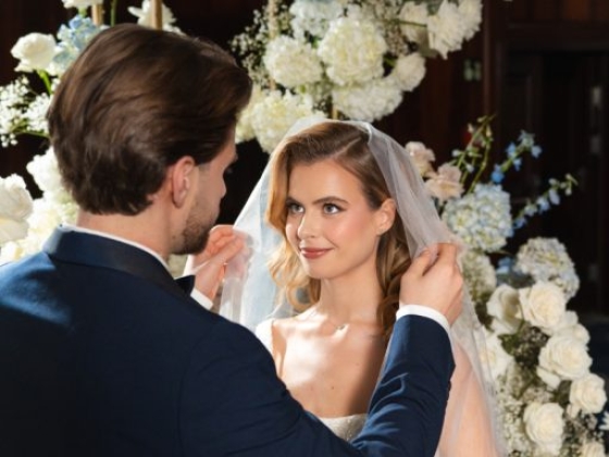 A couple sharing a tender moment during a wedding ceremony.