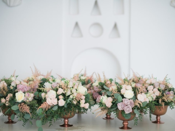 Beautiful pastel flowers in stylish centerpieces.