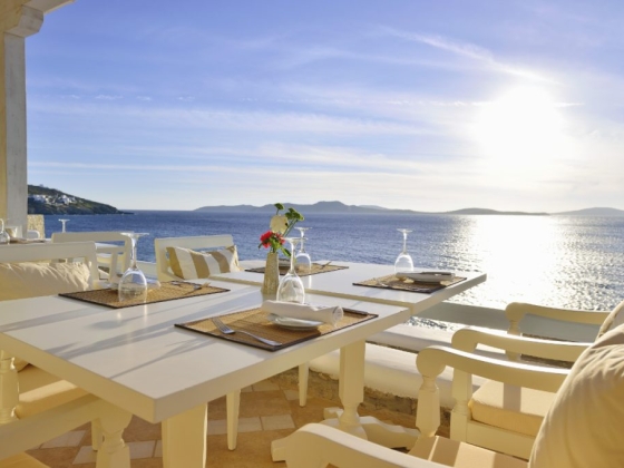 Serene outdoor dining by the water's edge.