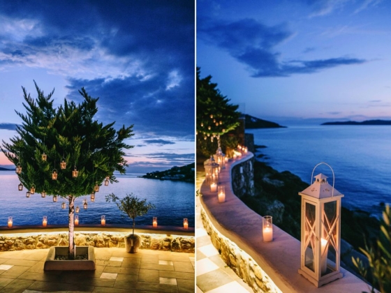 Scenic view with candles, tree, and ocean at dusk.