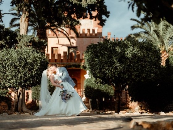 A romantic moment between a couple on their wedding day.