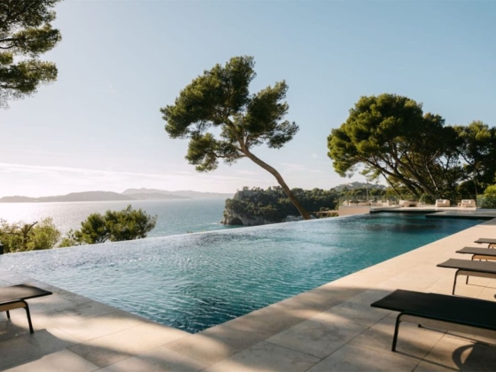 An elegant poolside view overlooking the ocean.