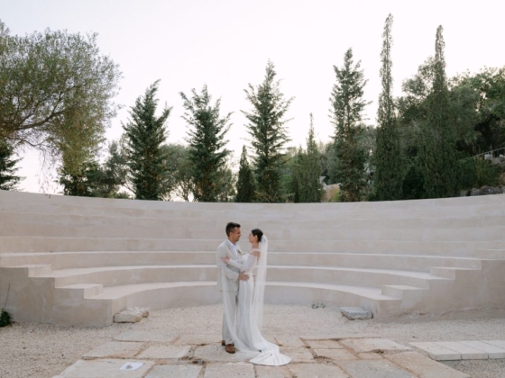 Bride and groom share a moment in a scenic venue.