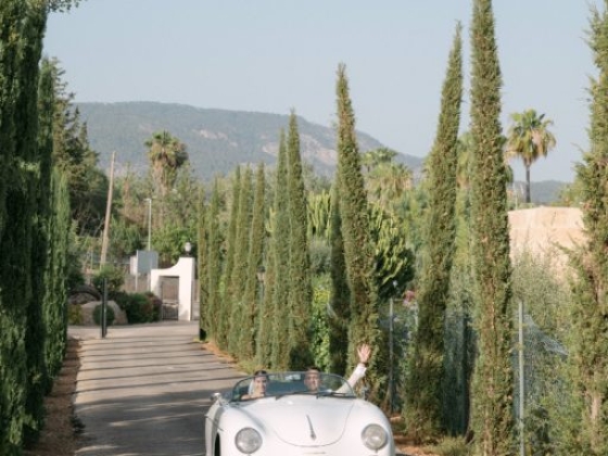 A couple enjoys a drive along a scenic path.
