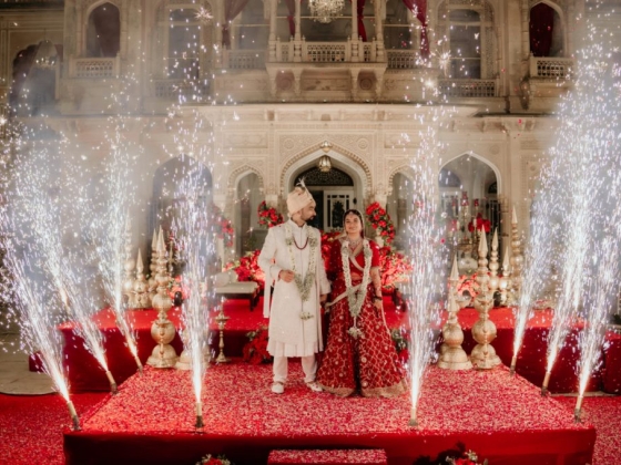 A joyful wedding celebration with fireworks and floral decor.