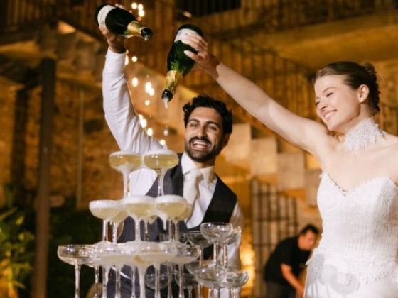 Joyful celebration with champagne and a glass tower