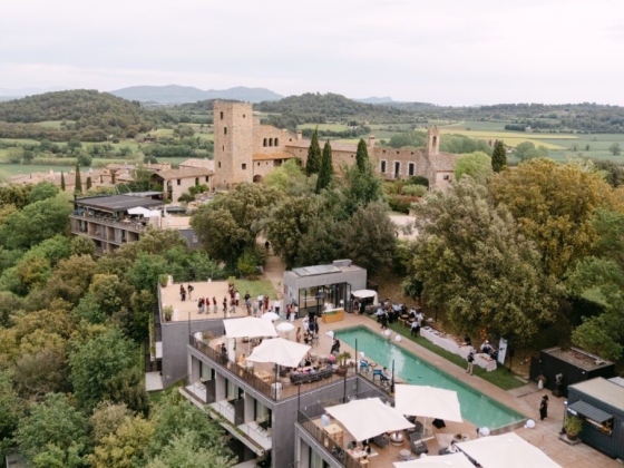 Elegant outdoor gathering at a scenic location with a pool.