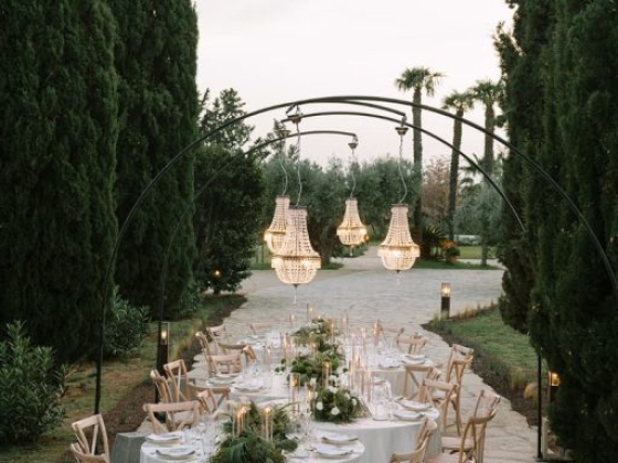 A beautifully arranged table for an outdoor dinner.
