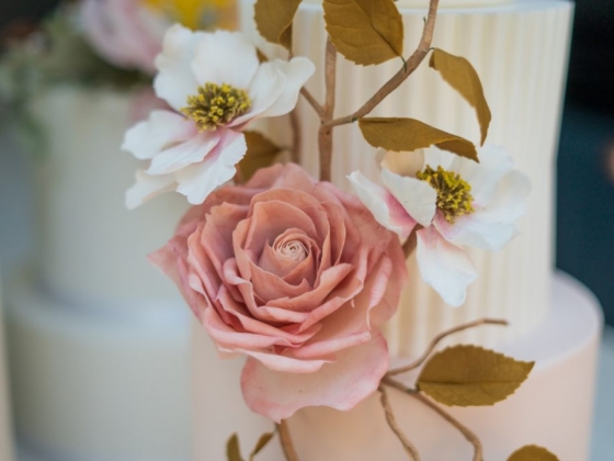 Close-up of a cake adorned with beautiful sugar flowers.