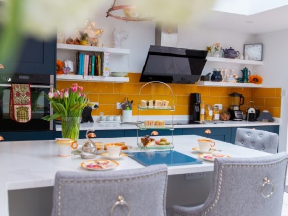 Bright kitchen featuring floral decor and snacks.