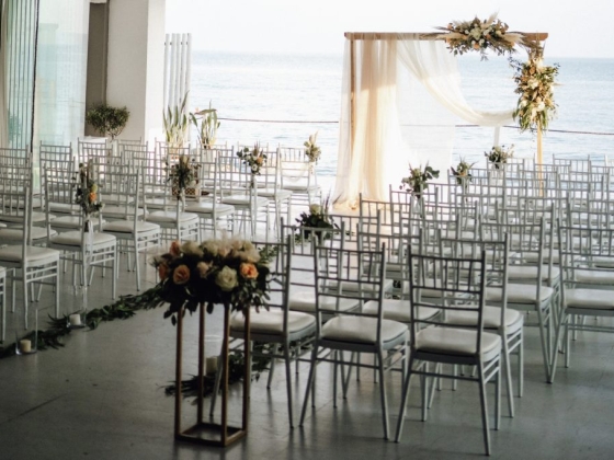 Elegant seating arrangement for a seaside wedding.