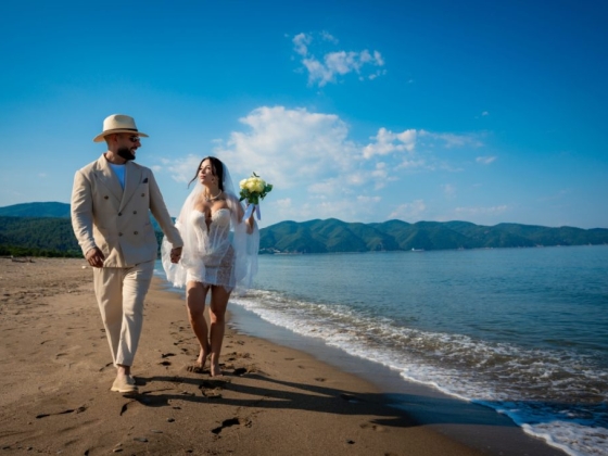 Celebrating love by the seaside on a sunny day.