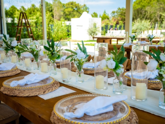 Beautifully arranged table for an outdoor event.