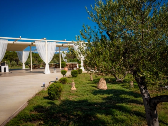 Charming venue for gatherings amidst lush landscaping.