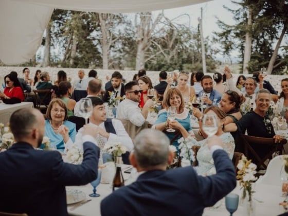 Guests enjoying drinks and celebrating together at a gathering.