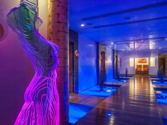 A colorful spa hallway featuring relaxing ambiance and decor.