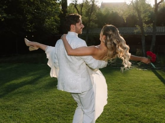 Couple celebrates their love in a sunny garden.