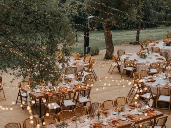 Beautifully arranged tables for an enchanting outdoor event.