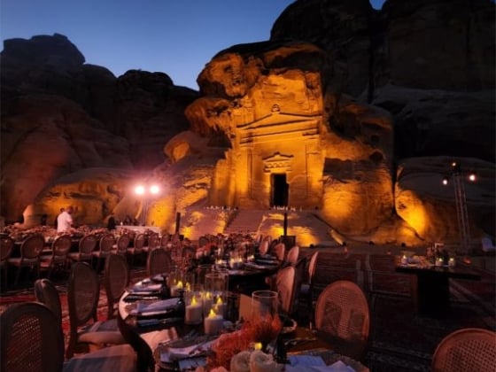 Elegant tables set for dinner against a stunning backdrop.