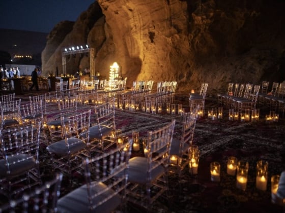 A beautiful illuminated seating arrangement for an event.