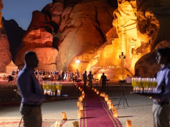 Guests enjoy a lavish celebration in a stunning natural setting.