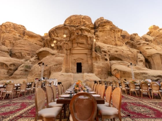Elegant table arrangement against stunning rock formations.