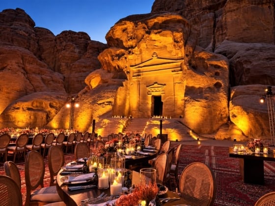Stunning dinner setting in a dramatic landscape at dusk.