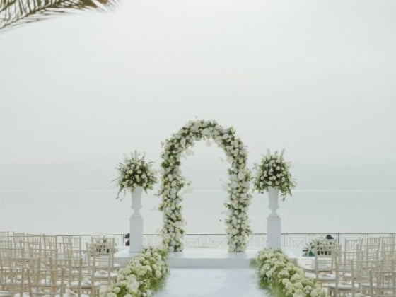 A serene wedding setup by the water.