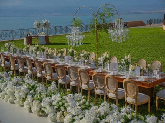 Stunning table setting by the water, perfect for an event.