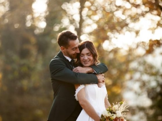 A romantic moment between a bride and groom outdoors.