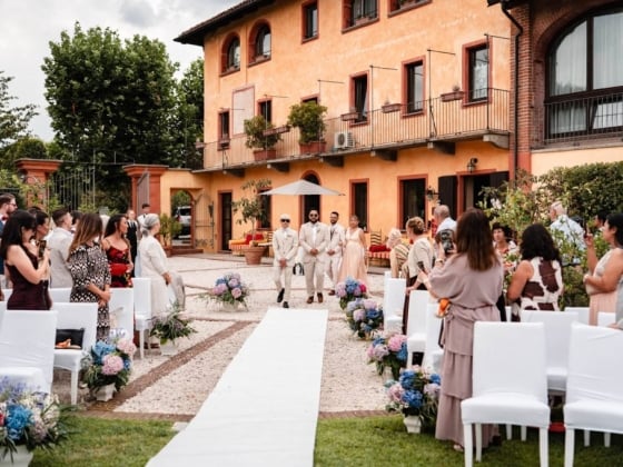 Guests gather for a wedding in a beautiful garden
