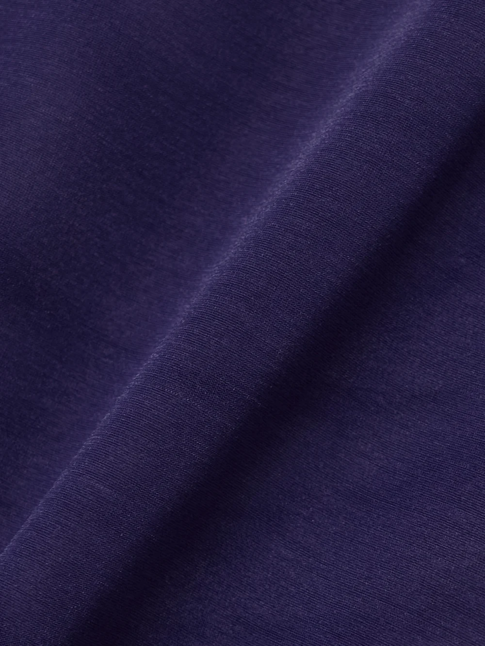 Close-up detail of the 16Arlington Isse Stretch-jersey Turtleneck Top