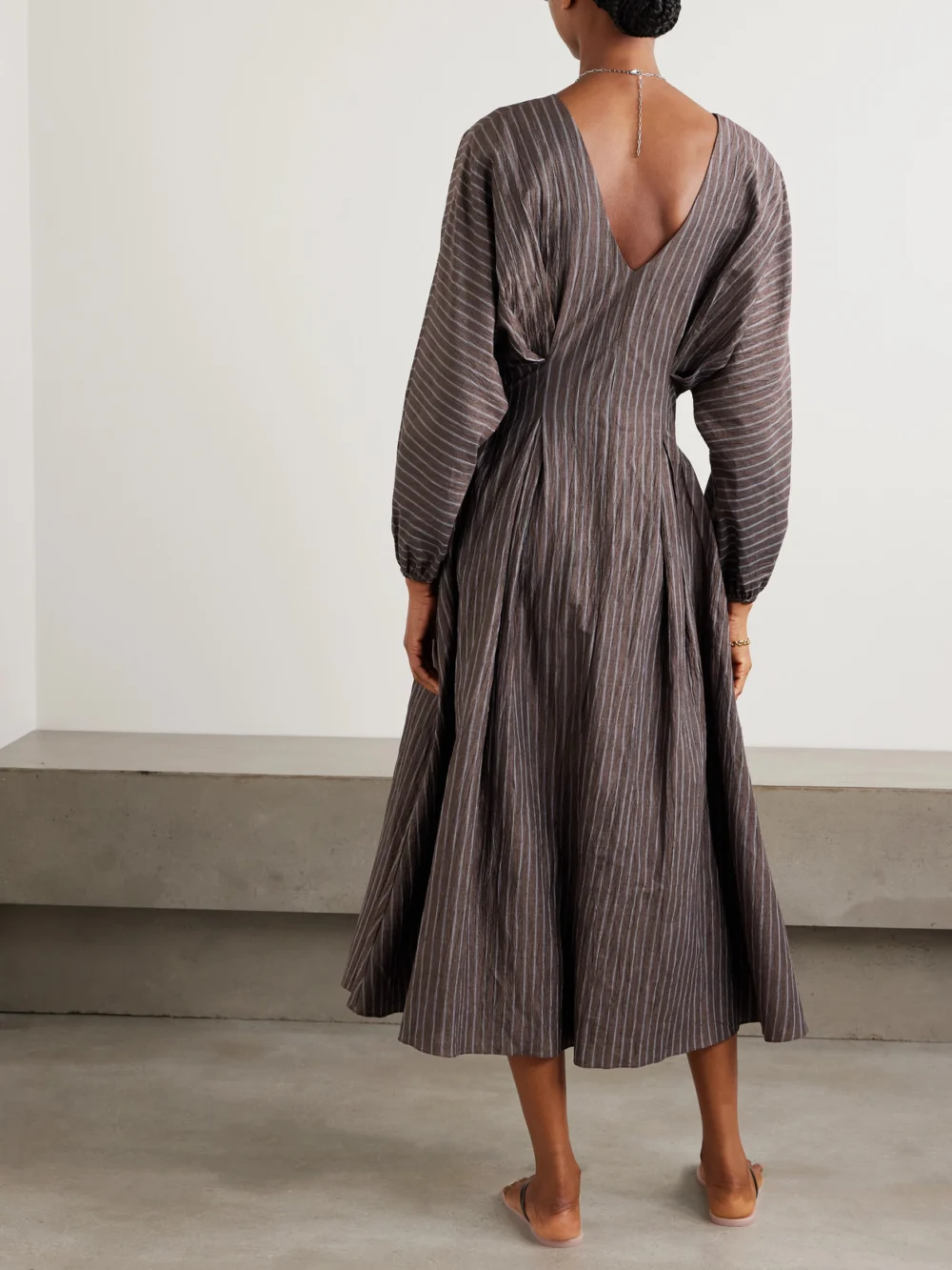 Back view of the Abadia Amaya Striped Pleated Linen-blend Midi Dress