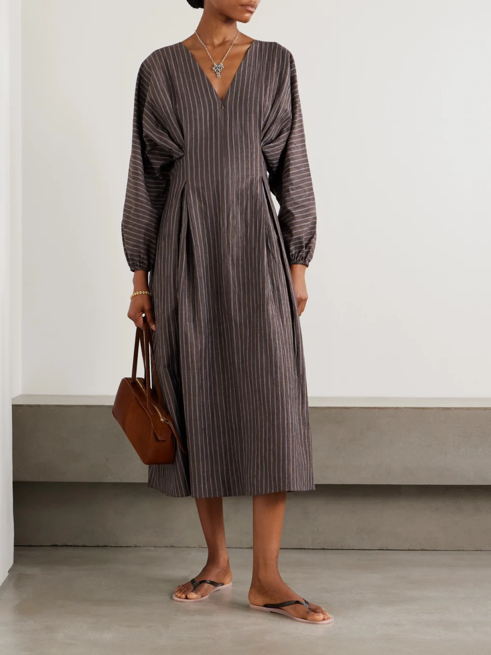 Abadia Amaya Striped Pleated Linen-blend Midi Dress, worn by a model